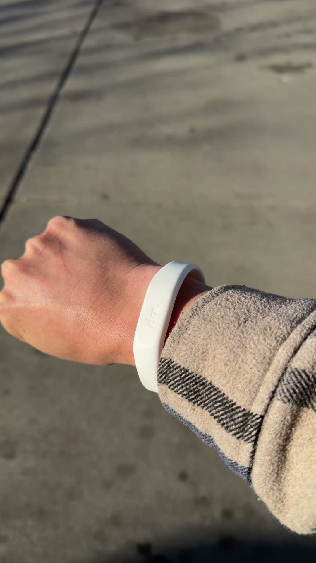DOT digital wristband on wrist